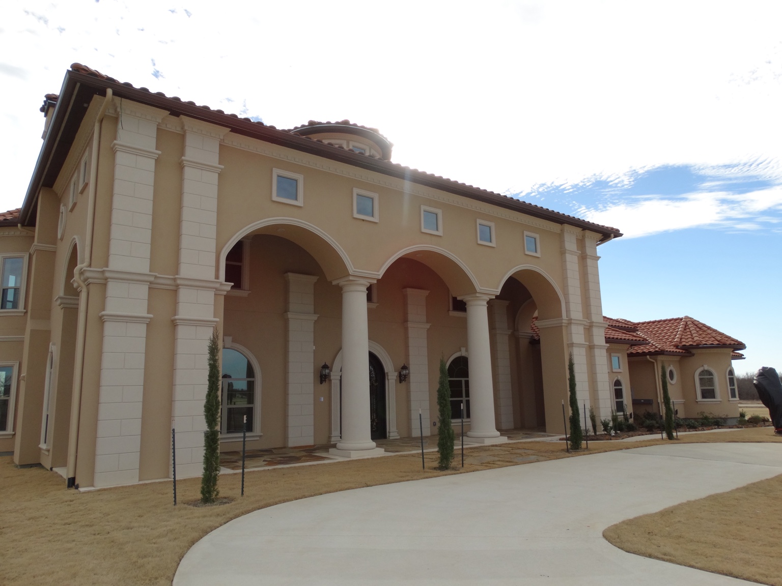 A completed Angel Custom Home with pool and pavilion at golden hour